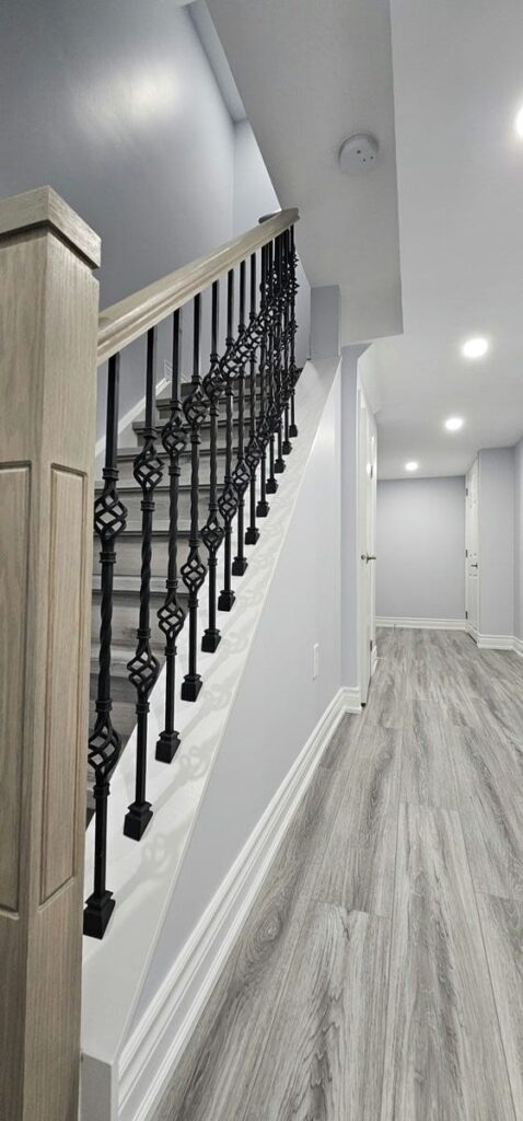 Custom vinyl steps and Oak railings with iron spindles