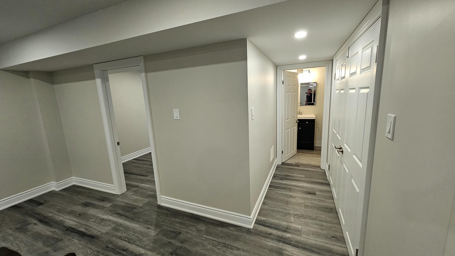 Hallway leading to the 3 piece bathroom and door to the bedroom on the left