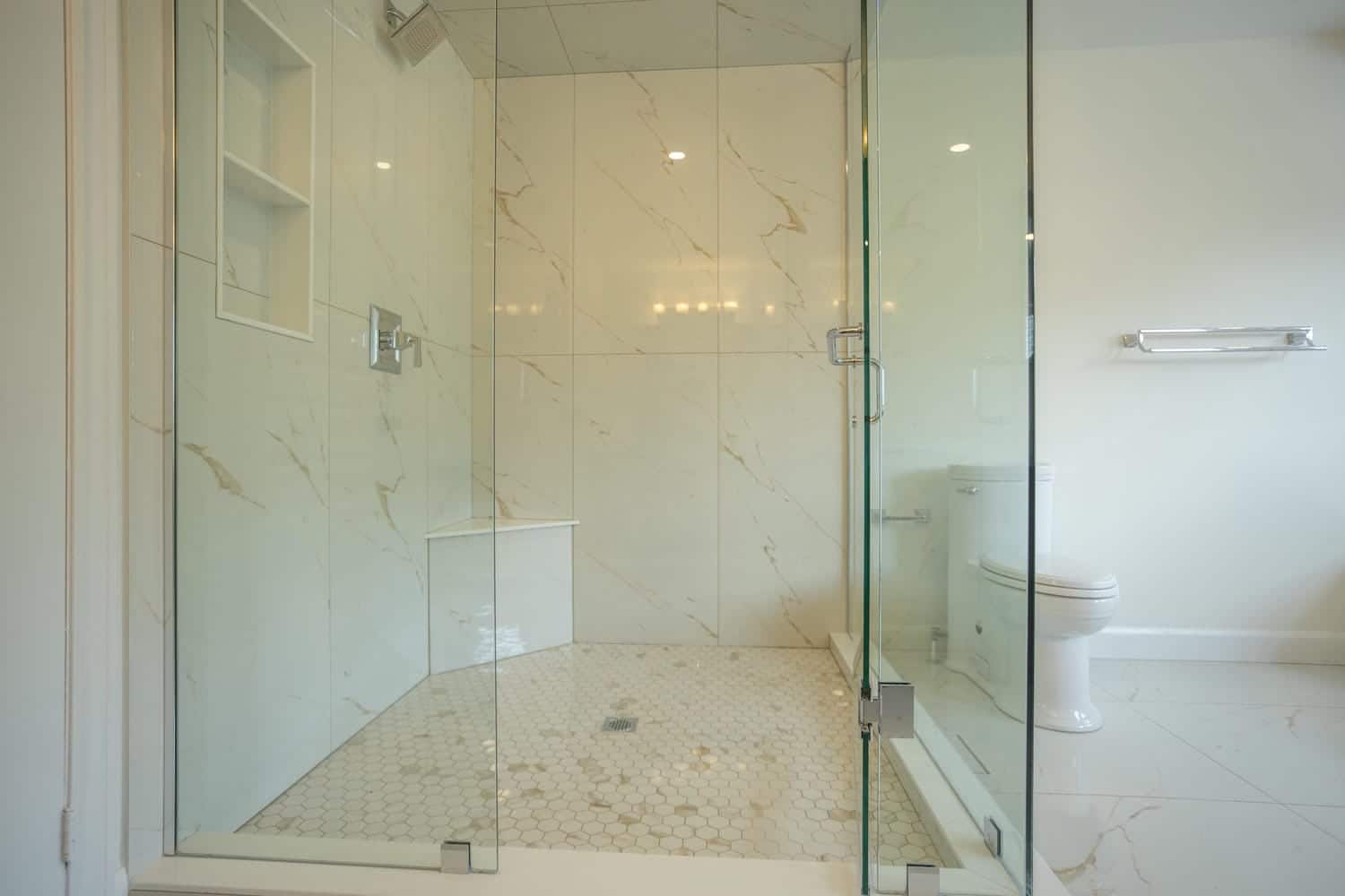 Open glass door with chrome hardware