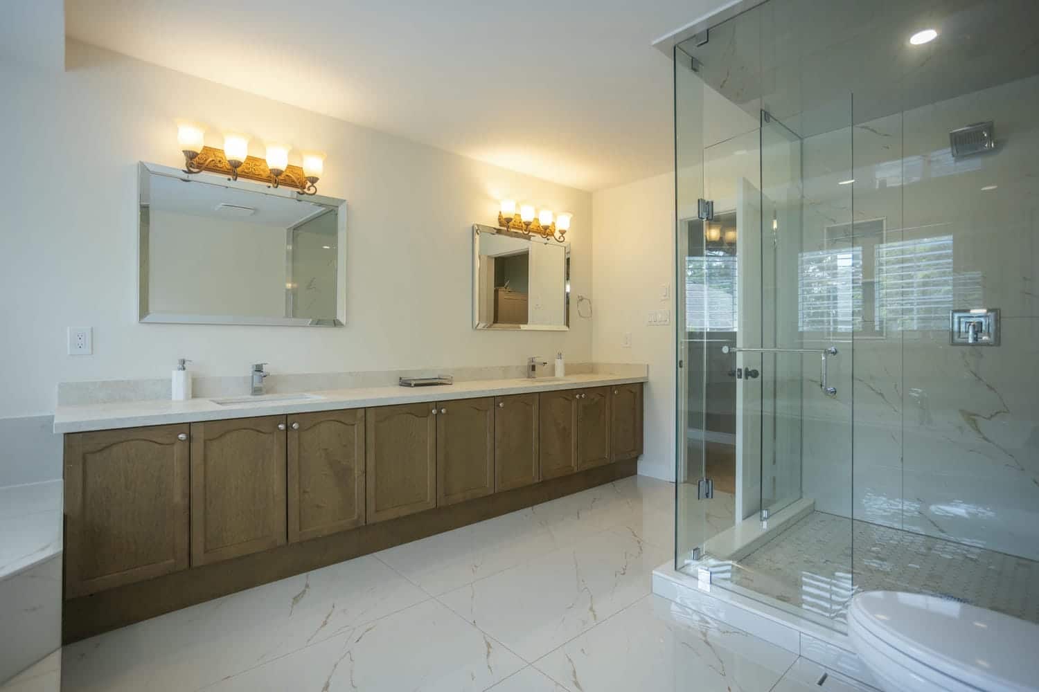 24 x 48 tile throughout the bathroom with a 6 cabinet large vanity