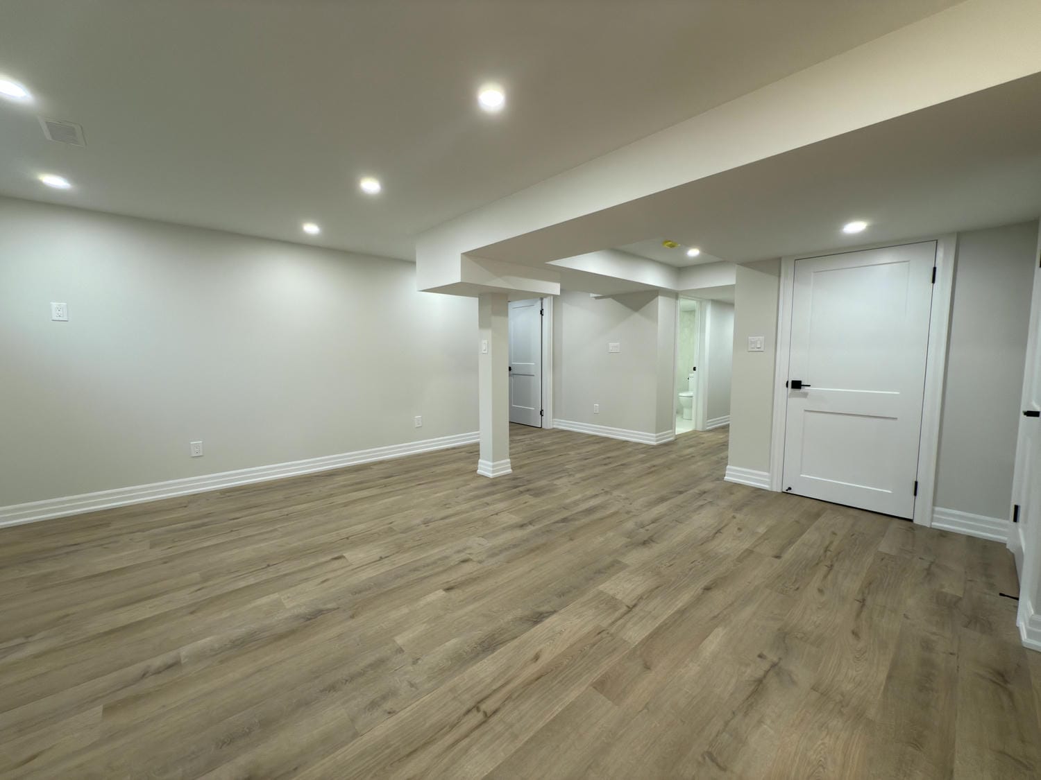 Wide open space with clean finishes and plenty of flexibility. Pot lights and warm flooring keep it bright and inviting.